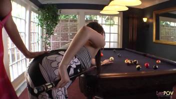 Teaching the cue stick holding technique ends up with the lesbian milf using her dildo on the brunette